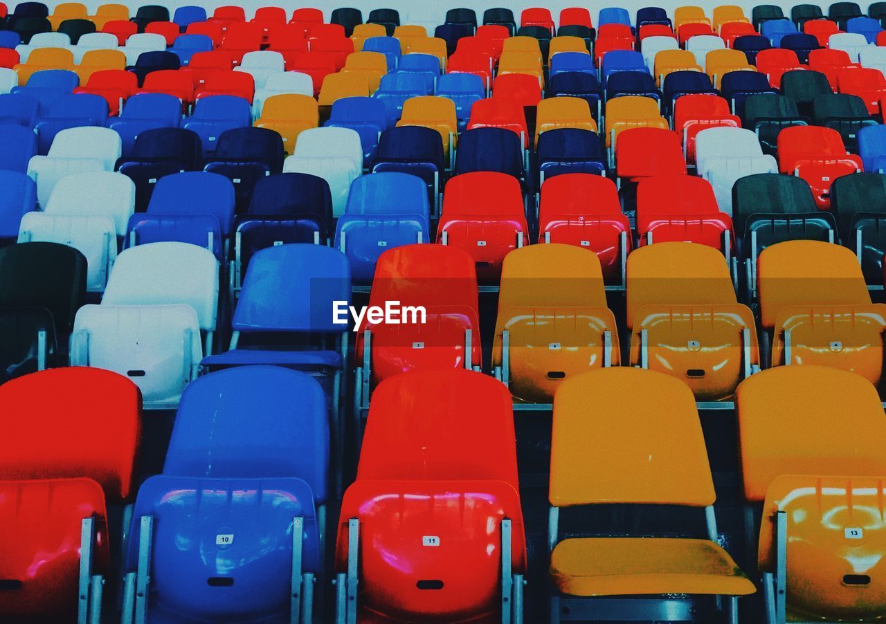 Full frame shot of empty chairs in stadium
