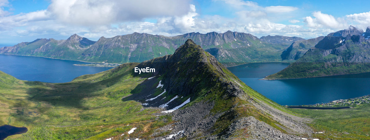 Panoramic view of lake and mountains against sky