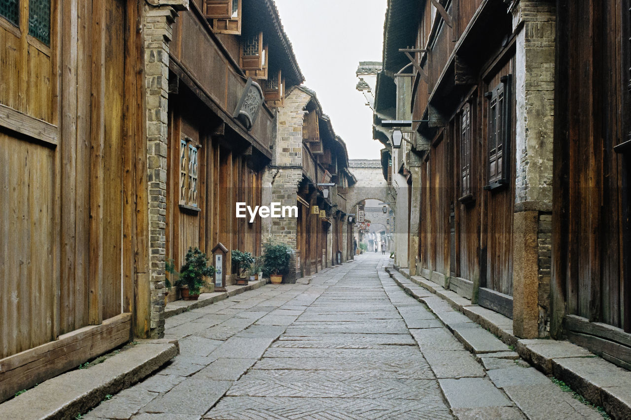 Street amidst buildings against sky