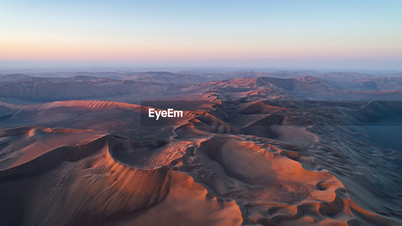 Aerial view of landscape during sunset