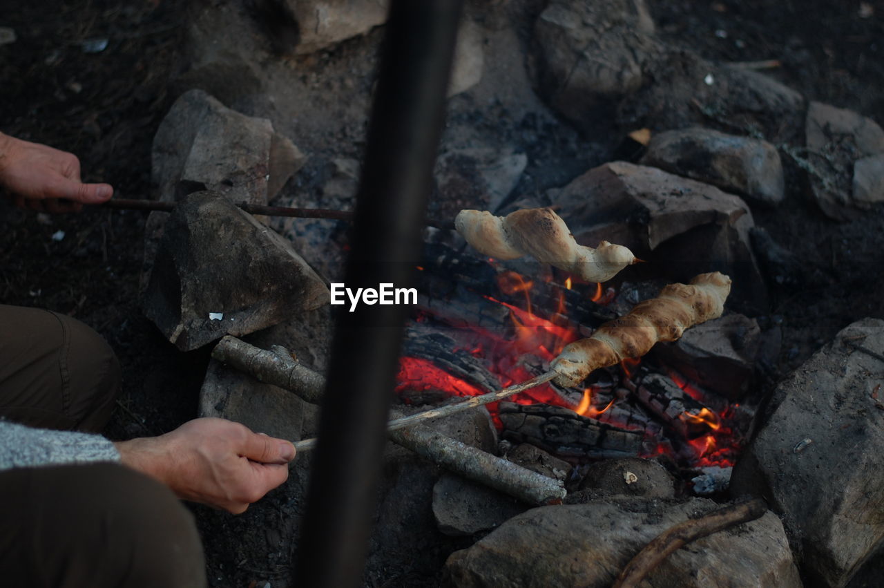 Cropped image of man cooking food