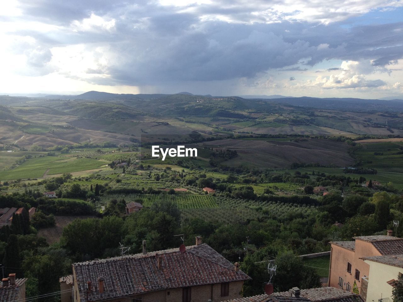 High angle view of house against cloudy sky