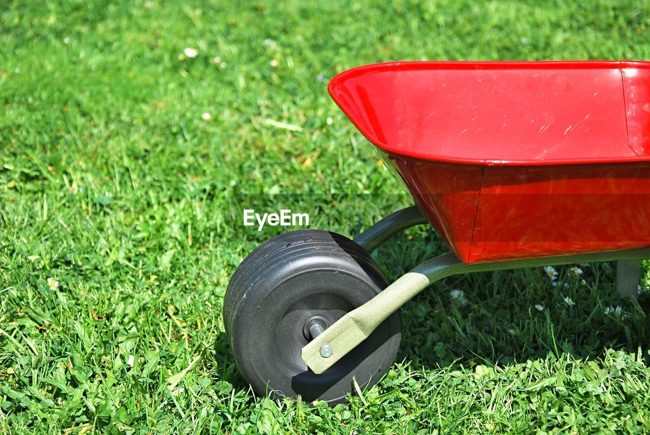 High angle view of wheelbarrow on field