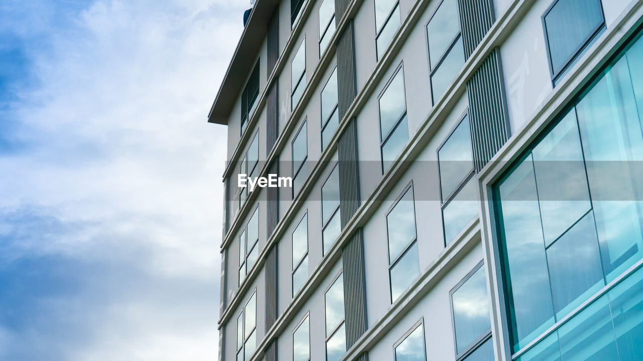 New apartment building over blue sky,low angle architectural exterior view of modern