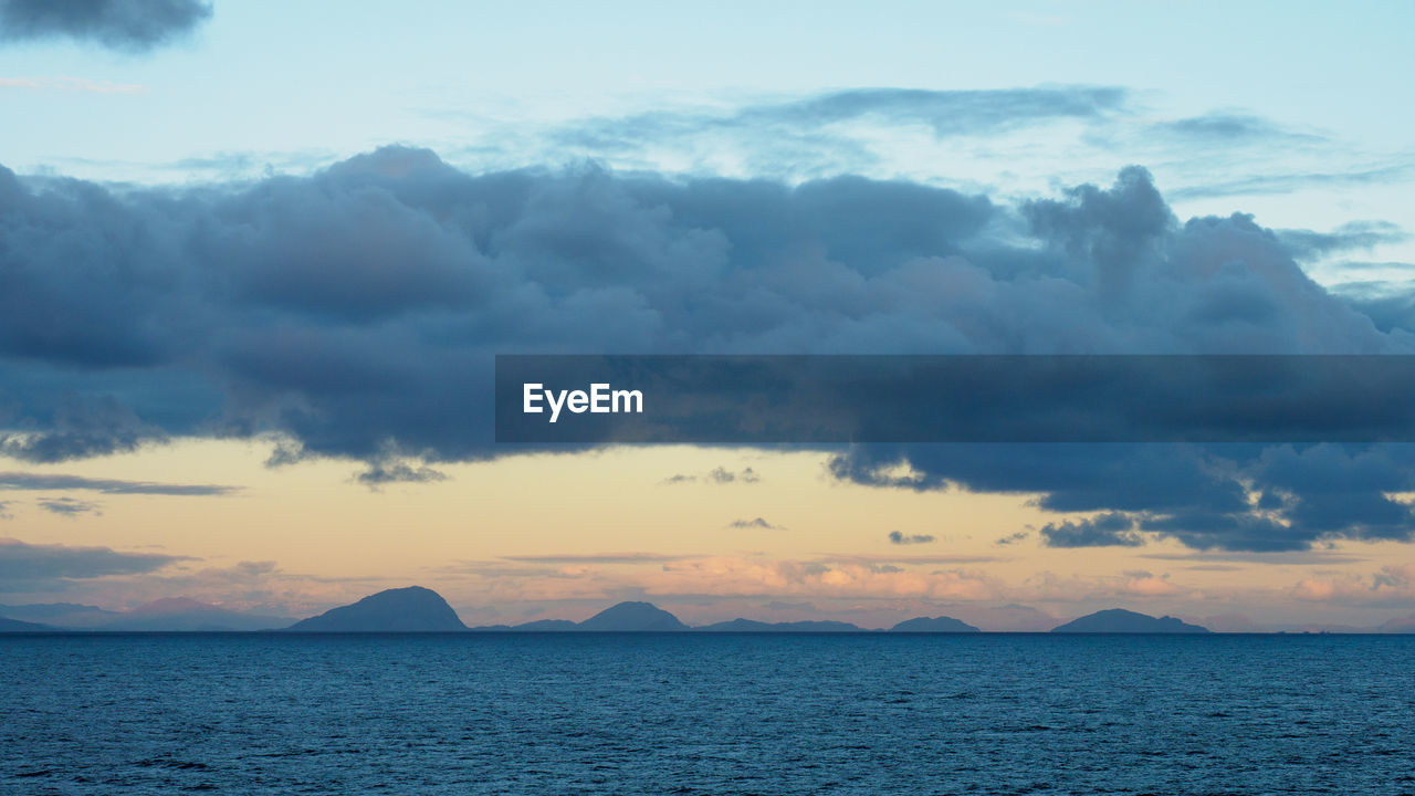 Scenic view of sea against dramatic sky