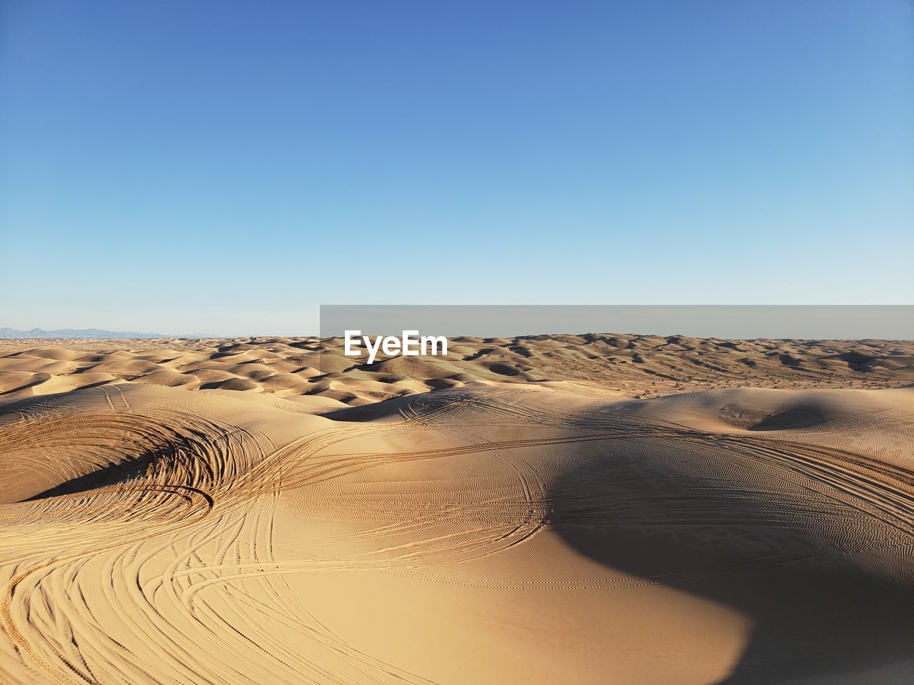 Scenic view of desert against clear sky