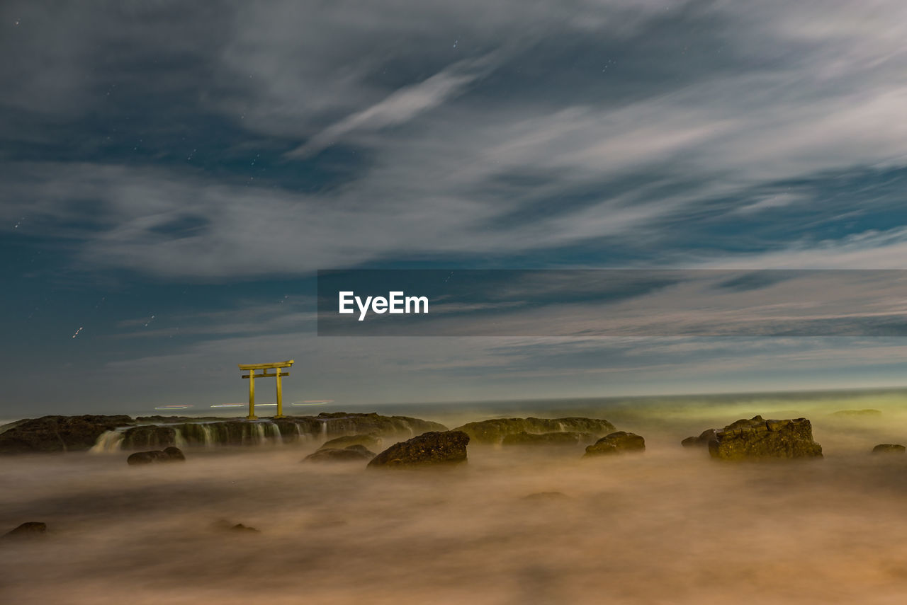 GAZEBO ON BEACH AGAINST SKY