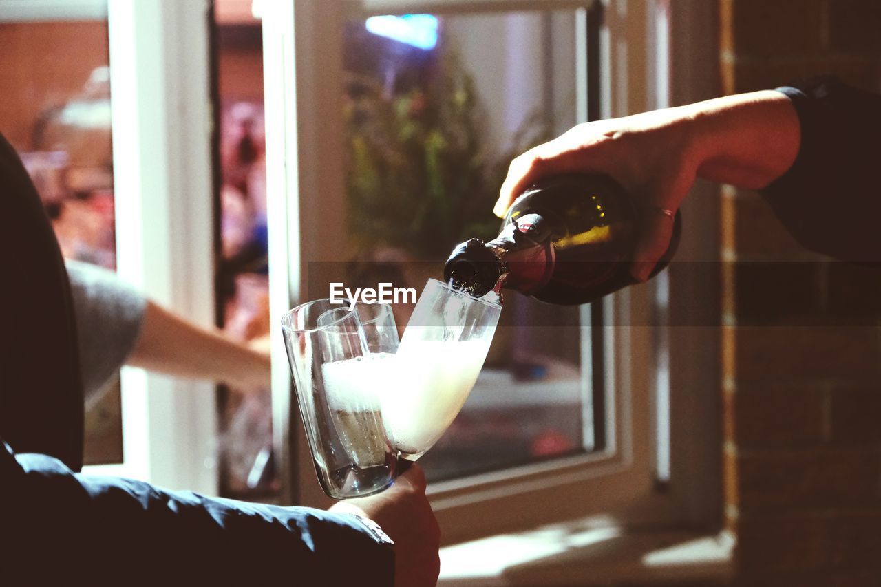 Cropped hand of man holding wineglass