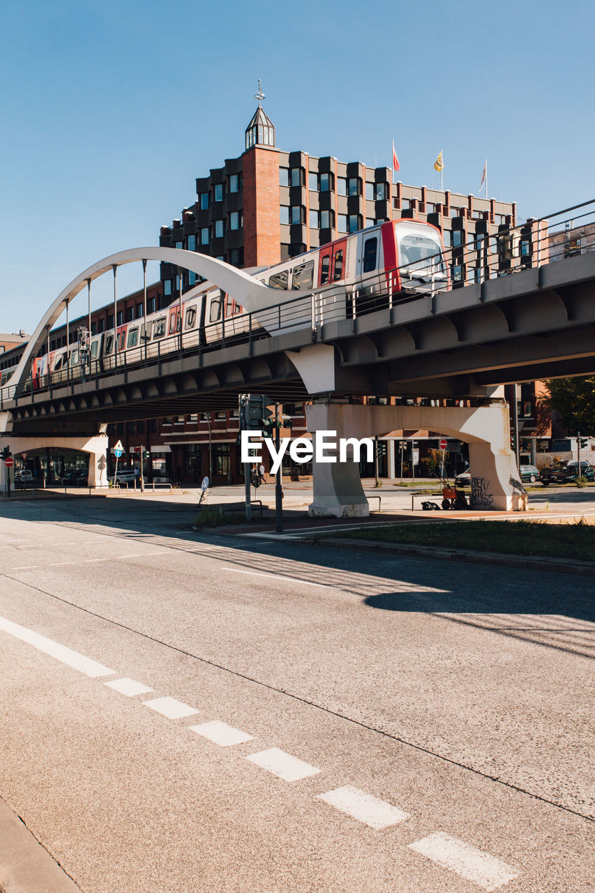 View of bridge in city against clear sky