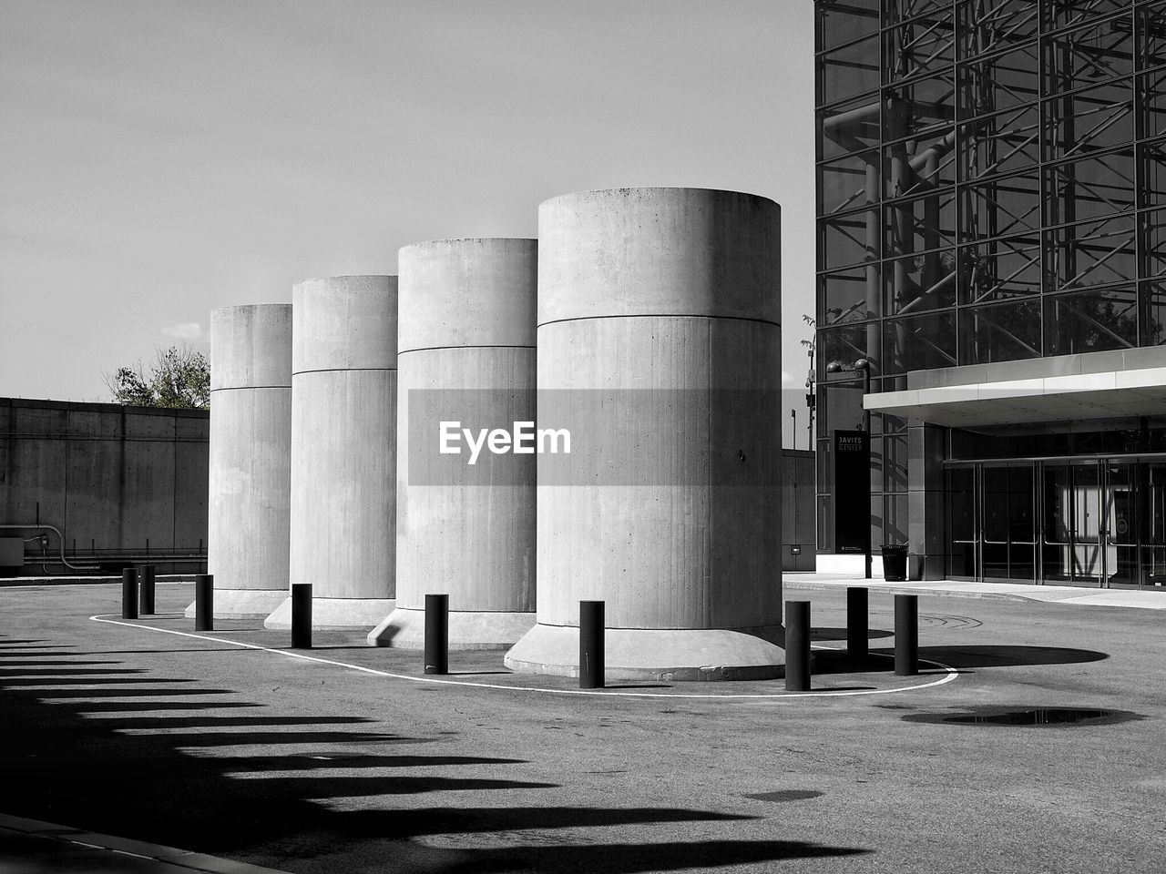 Factory and building in city against sky