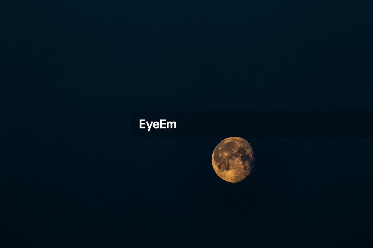 MOON AGAINST CLEAR SKY AT NIGHT