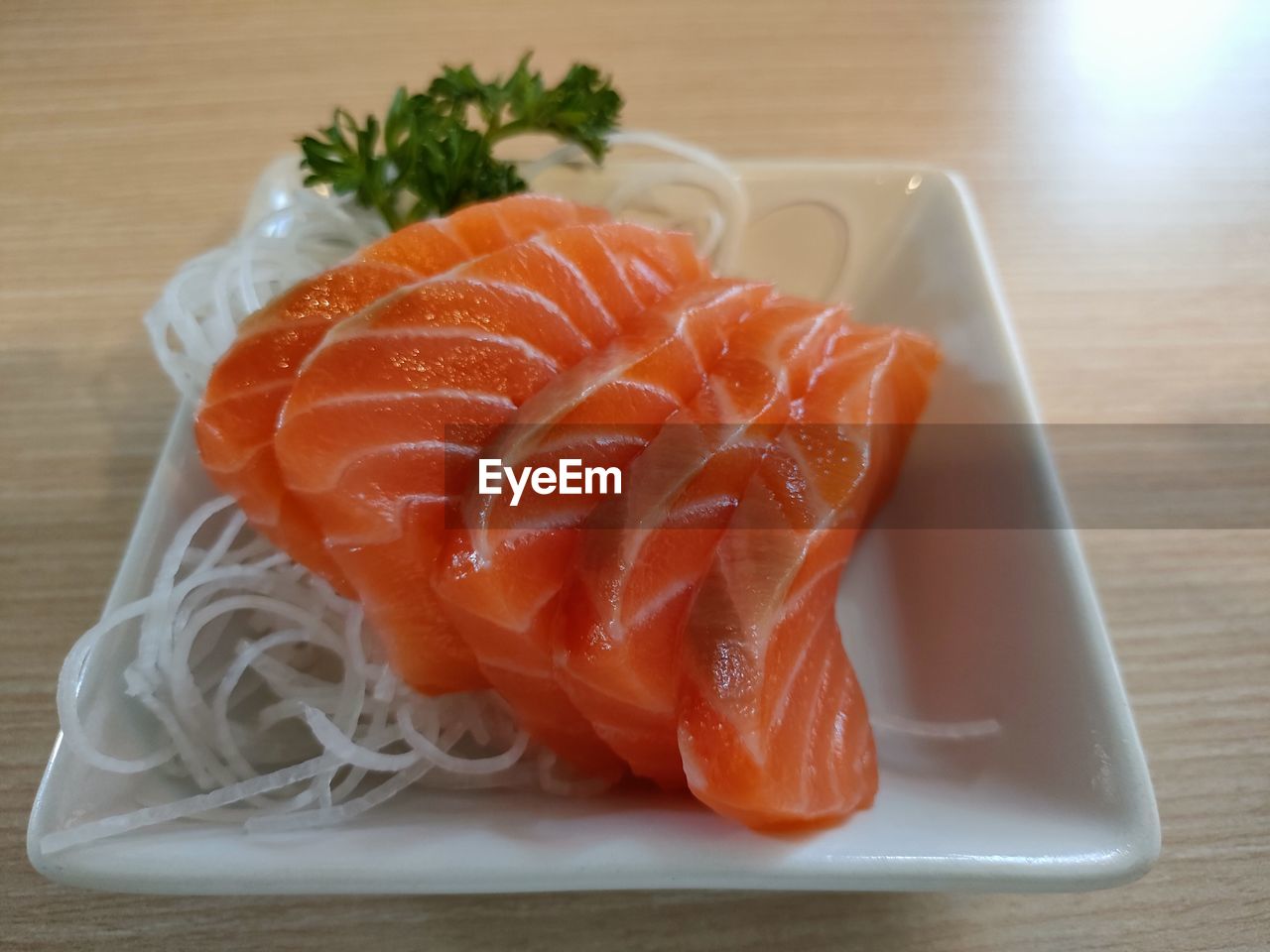 CLOSE-UP OF CHOPPED FISH ON PLATE