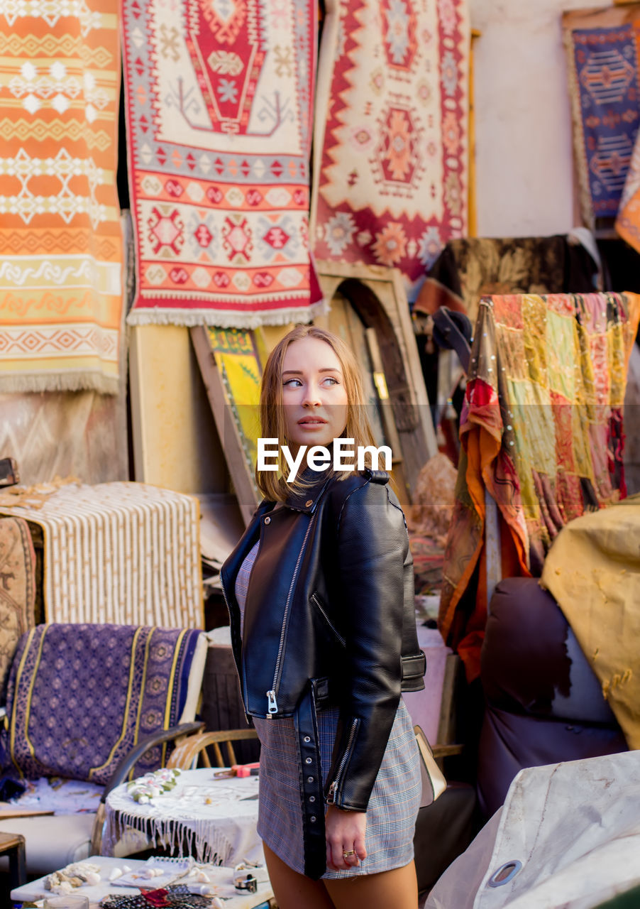 Woman standing at market stall