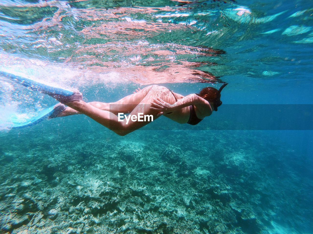 Woman swimming in sea