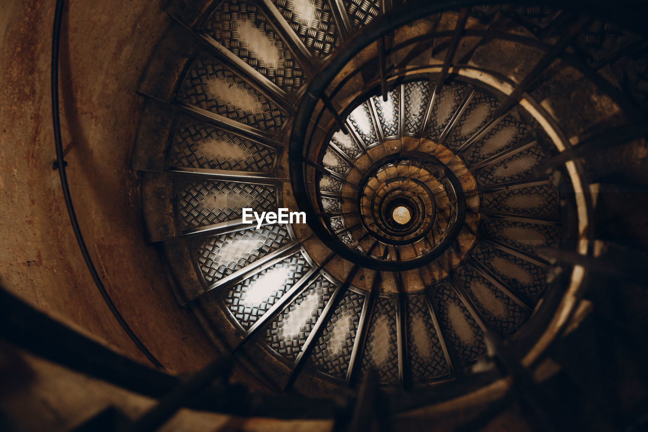 CLOSE-UP OF SPIRAL STAIRCASE IN BUILDING