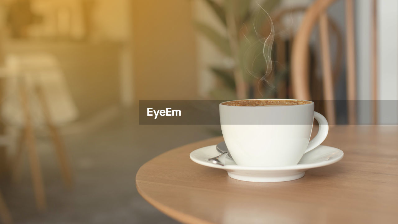 Close-up of coffee cup on table