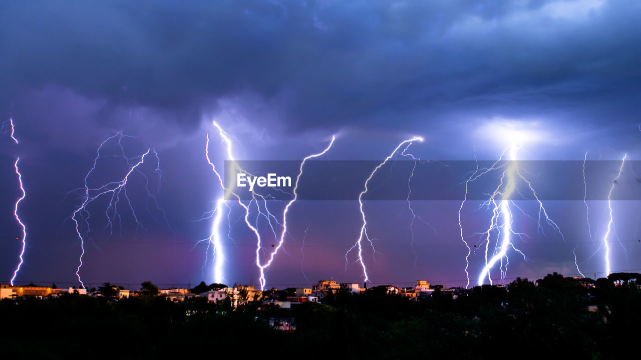 Lightning in sky at sunset