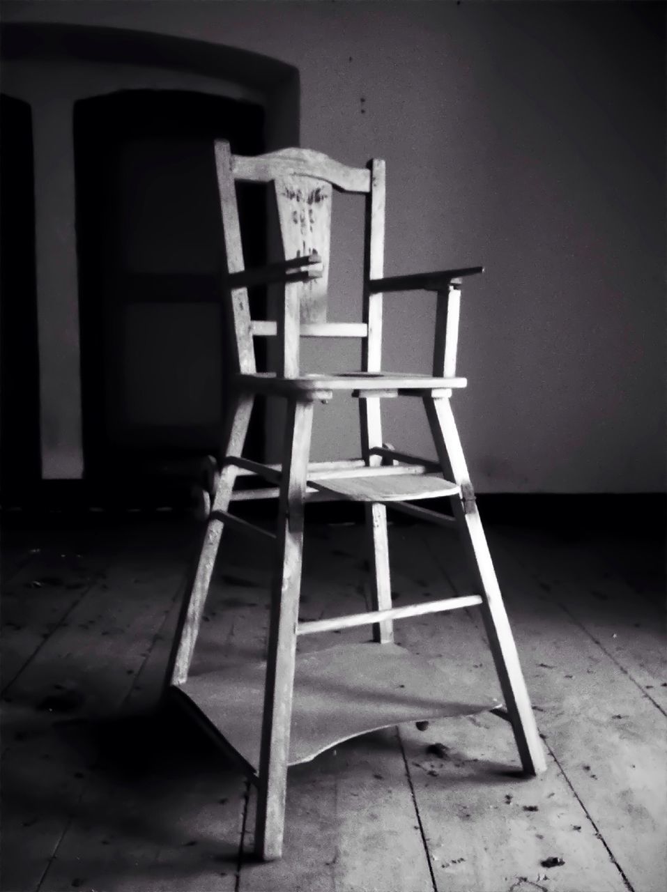 Close-up of rocking chair on wooden flooring at home