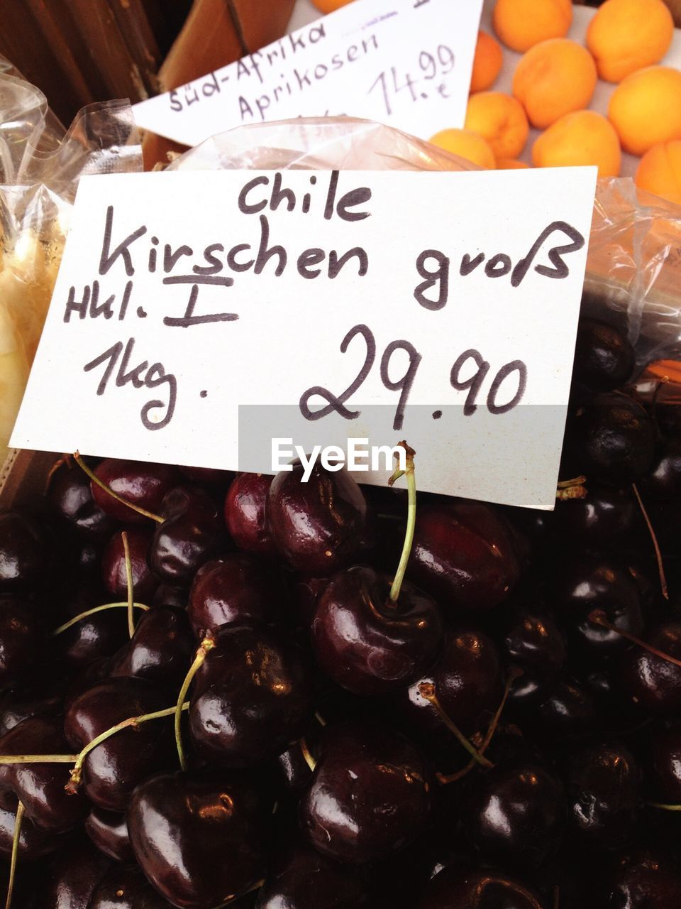 Close-up of red cherries for sale at market stall