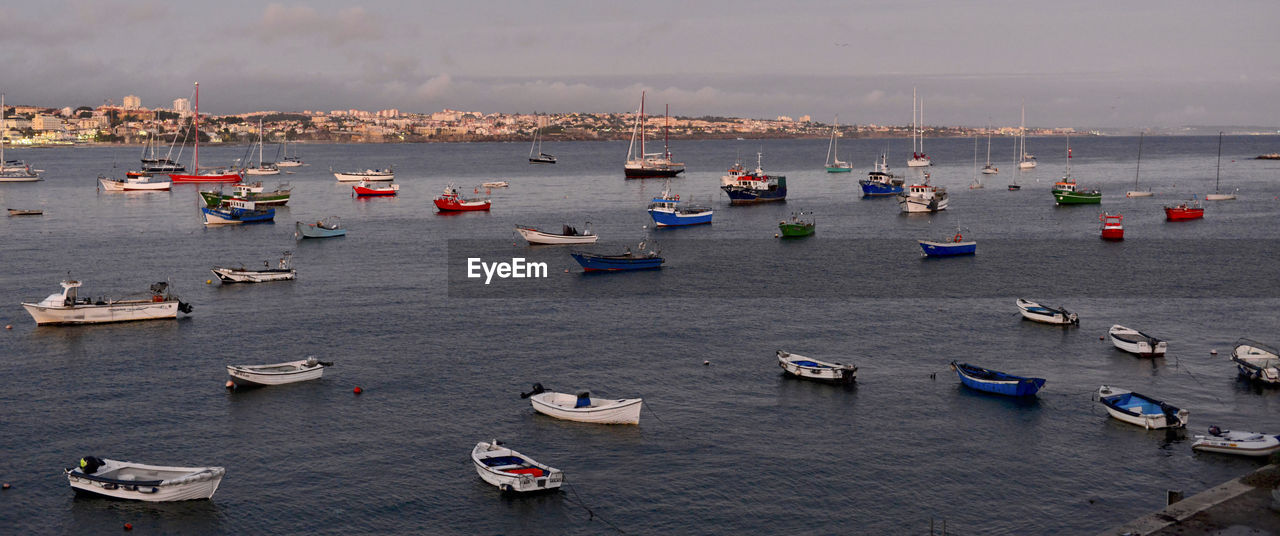 High angle view of sailboats moored in sea