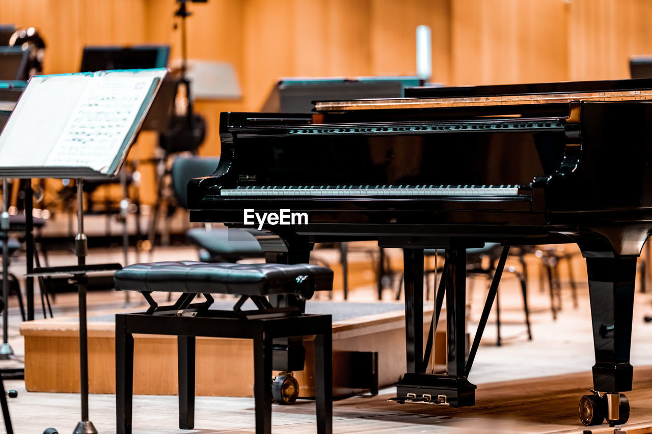 midsection of woman playing piano