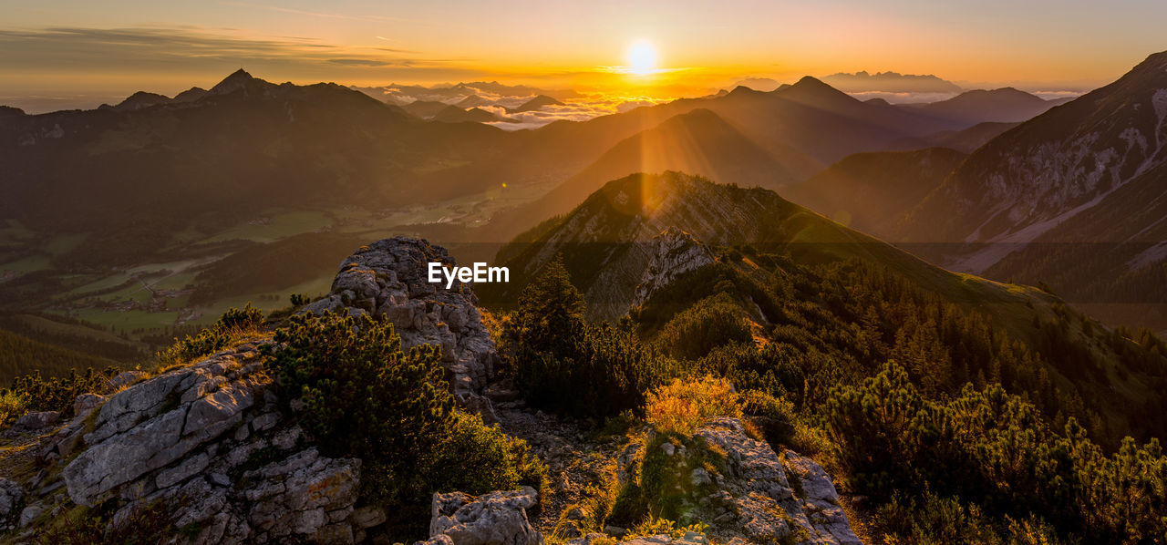 Scenic view of mountains against sky during sunset