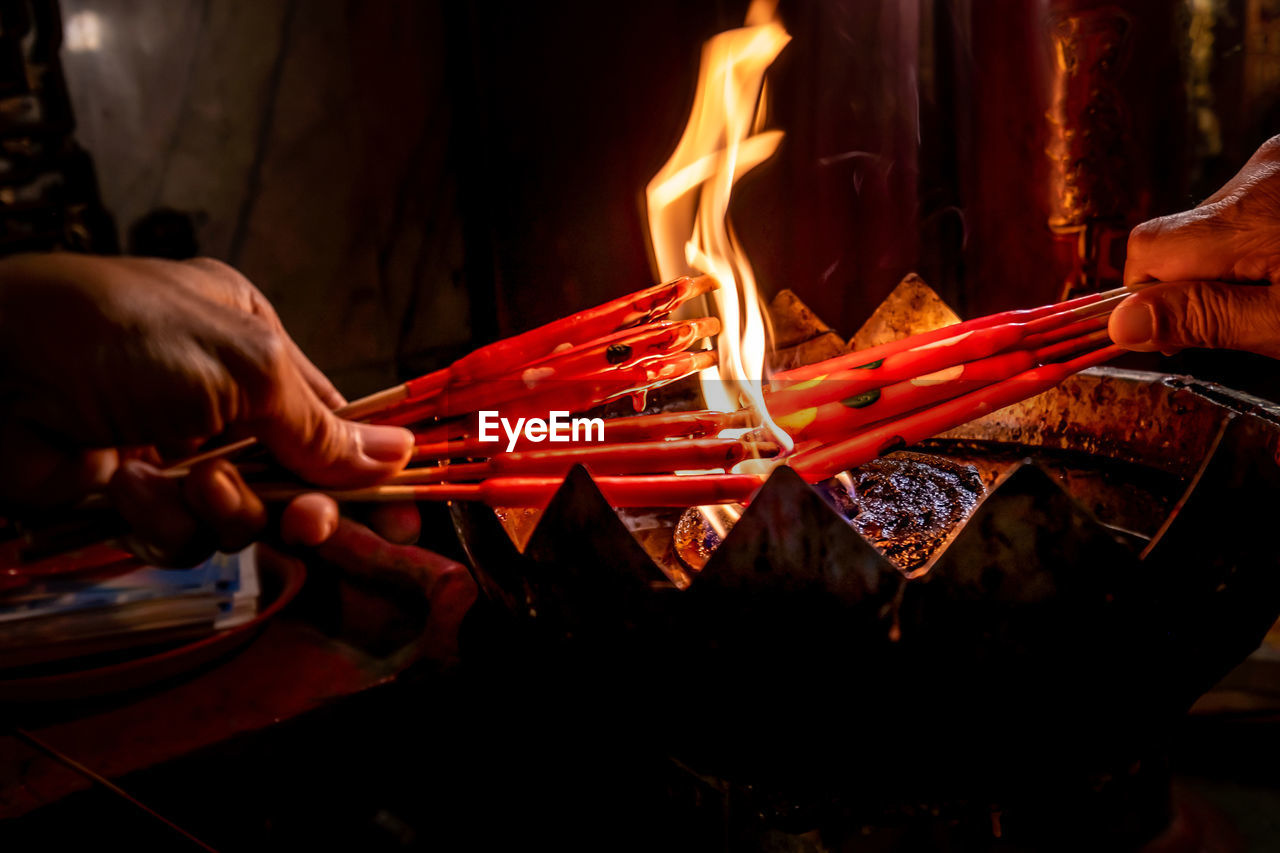 hand, burning, fire, heat, flame, one person, men, adult, campfire, occupation, nature, holding, fireplace, indoors, glowing, wood, food and drink, business