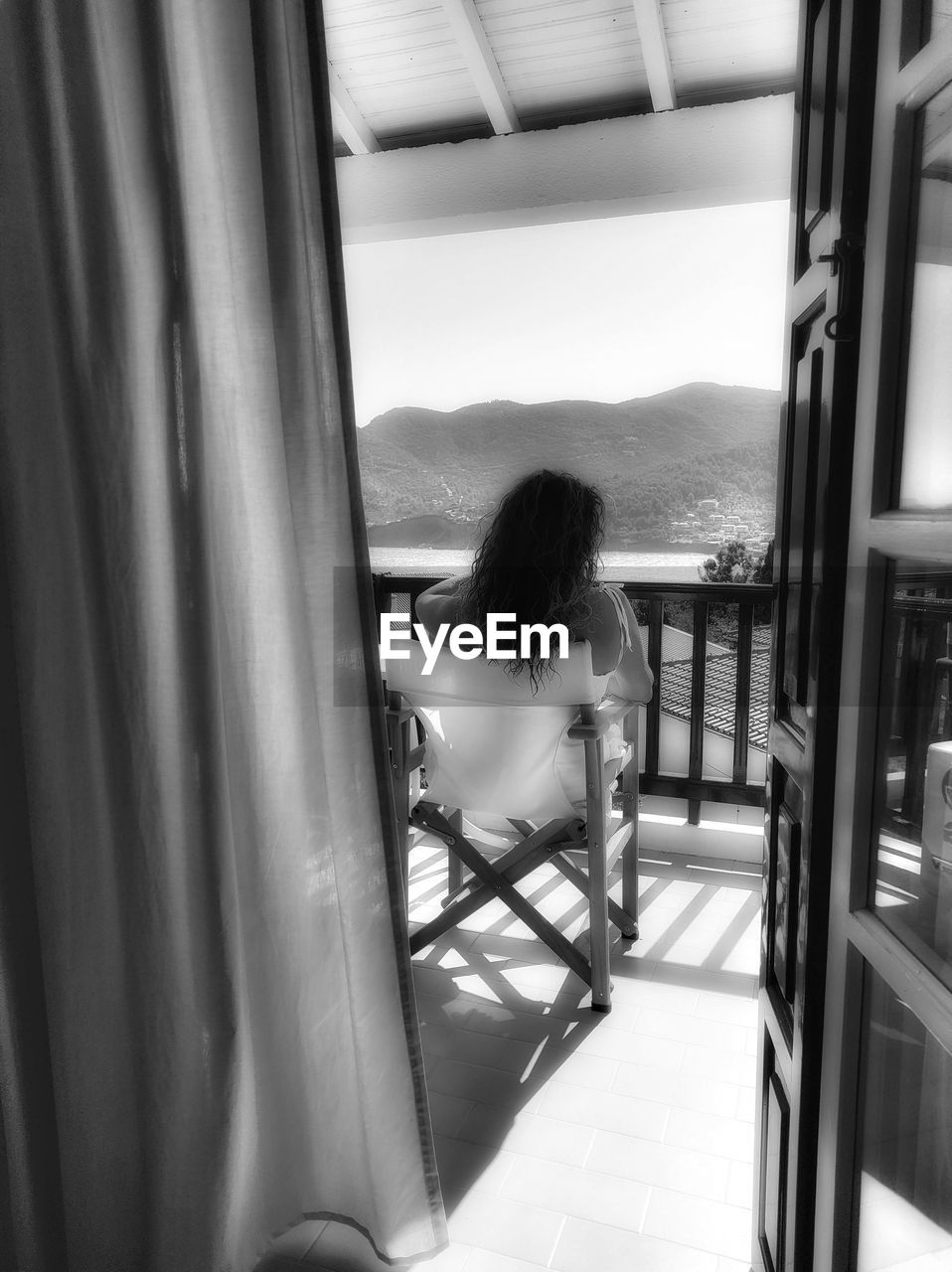 black, black and white, one person, women, white, adult, monochrome photography, indoors, window, lifestyles, rear view, monochrome, sitting, leisure activity, day, full length, young adult, nature, home interior, architecture, female, looking, interior design, relaxation, casual clothing, person, glass, looking through window, hairstyle