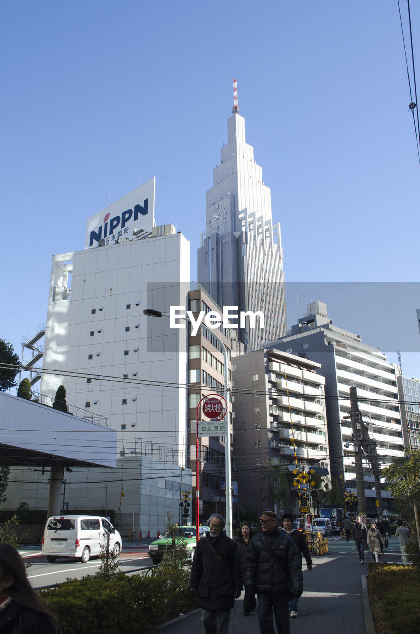 VIEW OF MODERN BUILDINGS AGAINST BLUE SKY