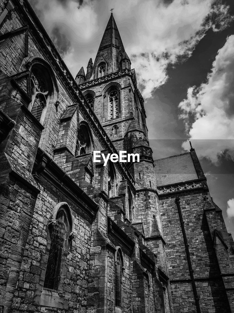architecture, built structure, building exterior, black and white, sky, low angle view, place of worship, religion, building, monochrome, cloud, monochrome photography, history, belief, the past, spirituality, travel destinations, tower, worship, no people, nature, black, catholicism, travel, gothic style, old, city, spire, tourism, outdoors, day, landmark