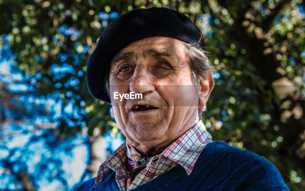 Blind man against trees