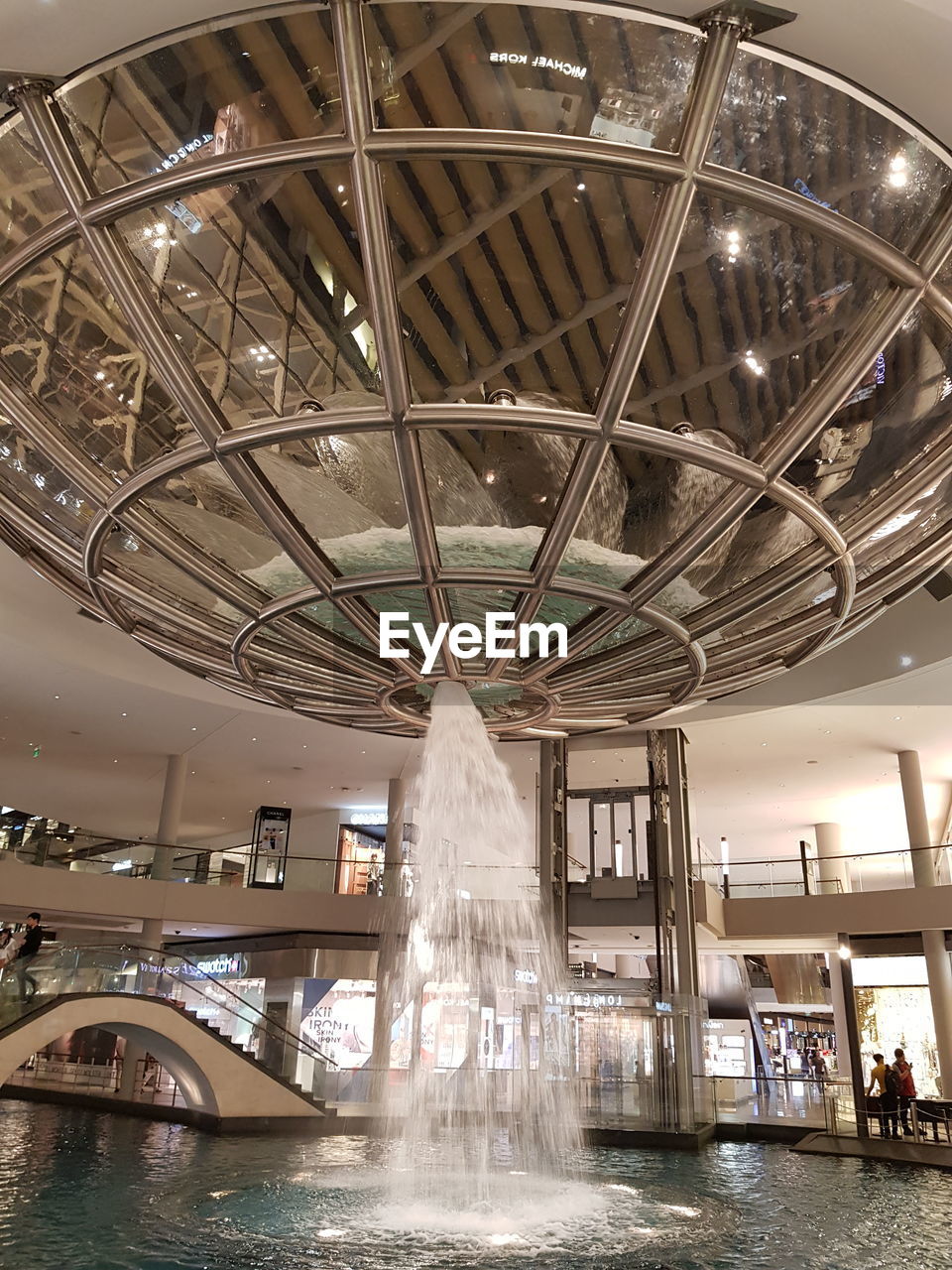 LOW ANGLE VIEW OF ILLUMINATED SHOPPING MALL