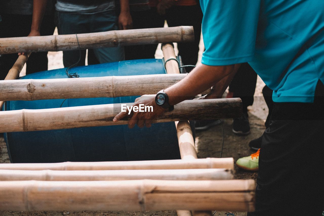 People making barrel raft