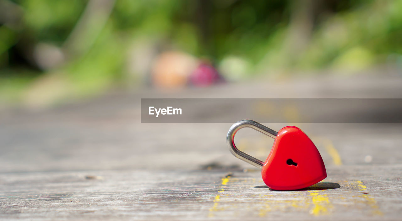 CLOSE-UP OF PADLOCK ON HEART SHAPE