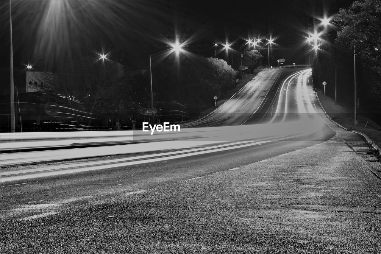 Light trails on street in city at night