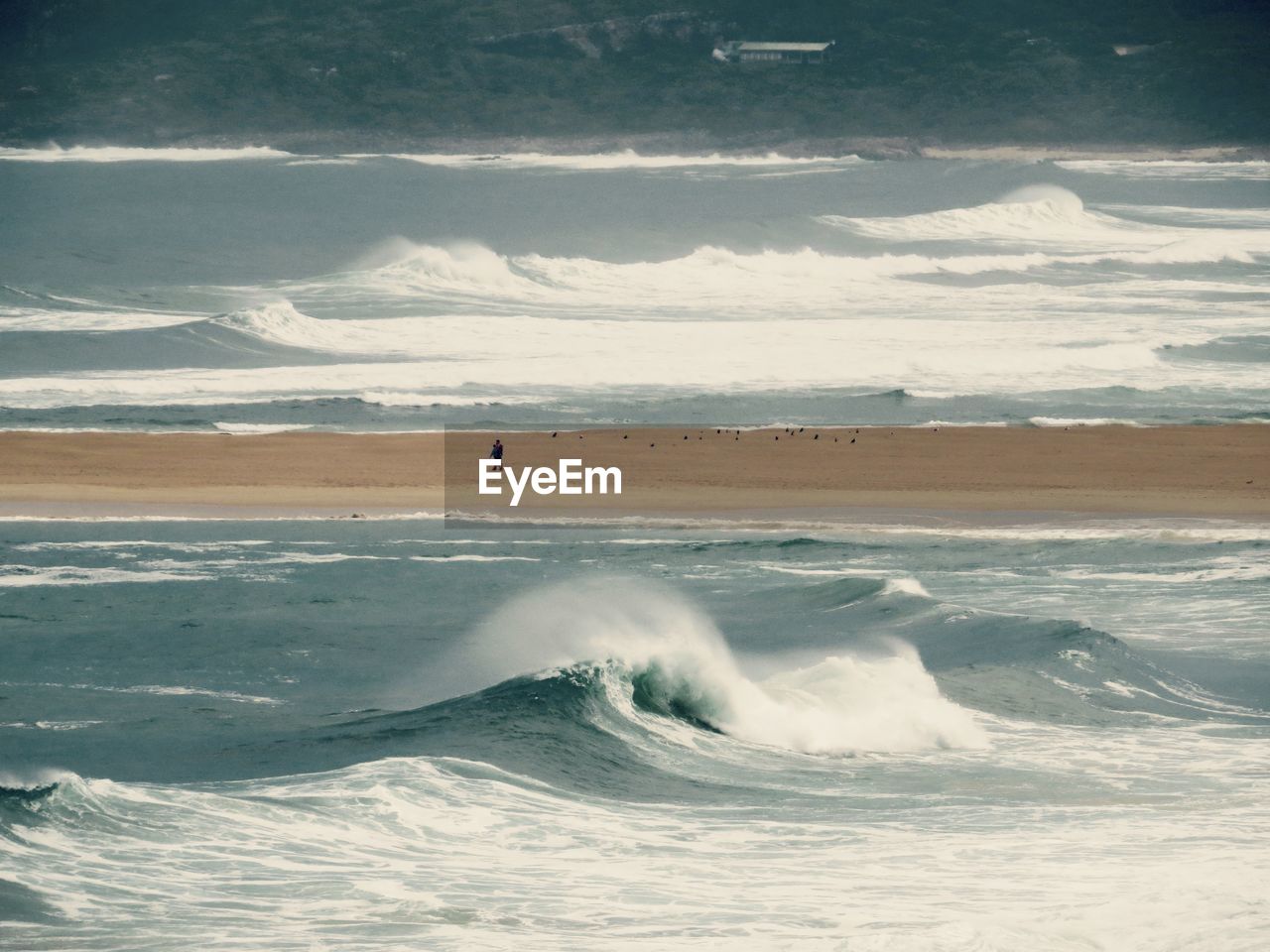 Scenic view of sea waves against sky