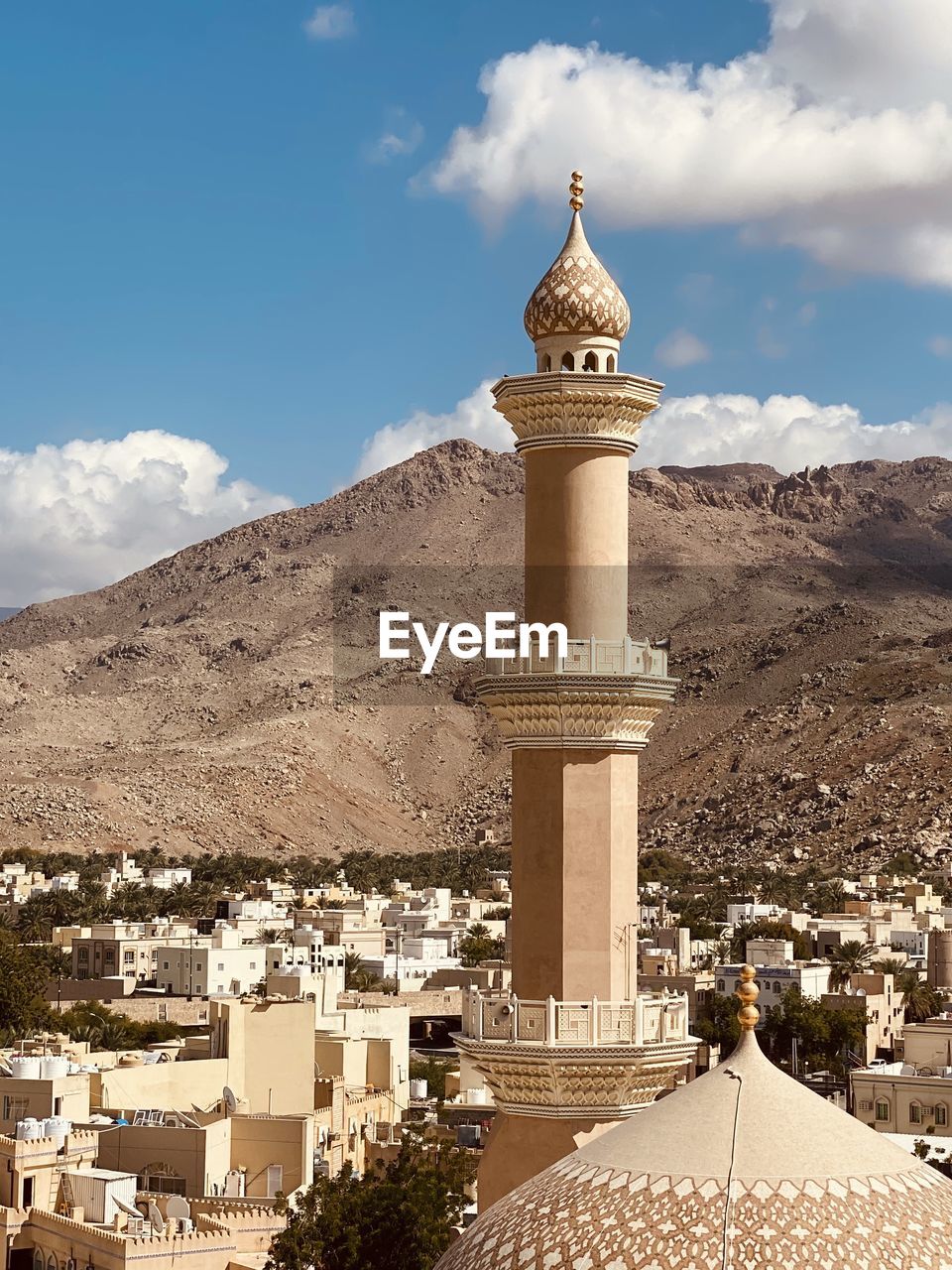 Historic buildings and mountain against sky