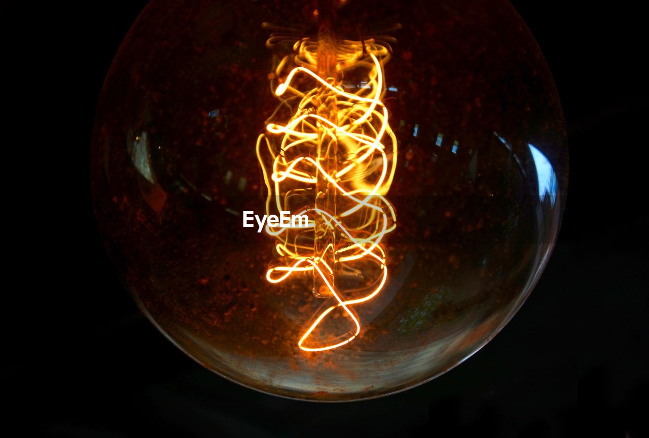 Close-up of illuminated light bulb