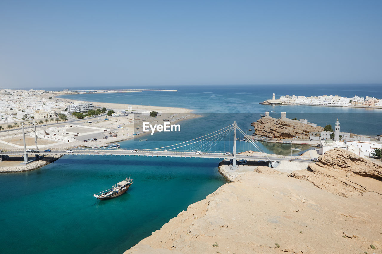 Sur cityscape with al aygaz suspension bridge. travel destination on coast of the gulf of oman.