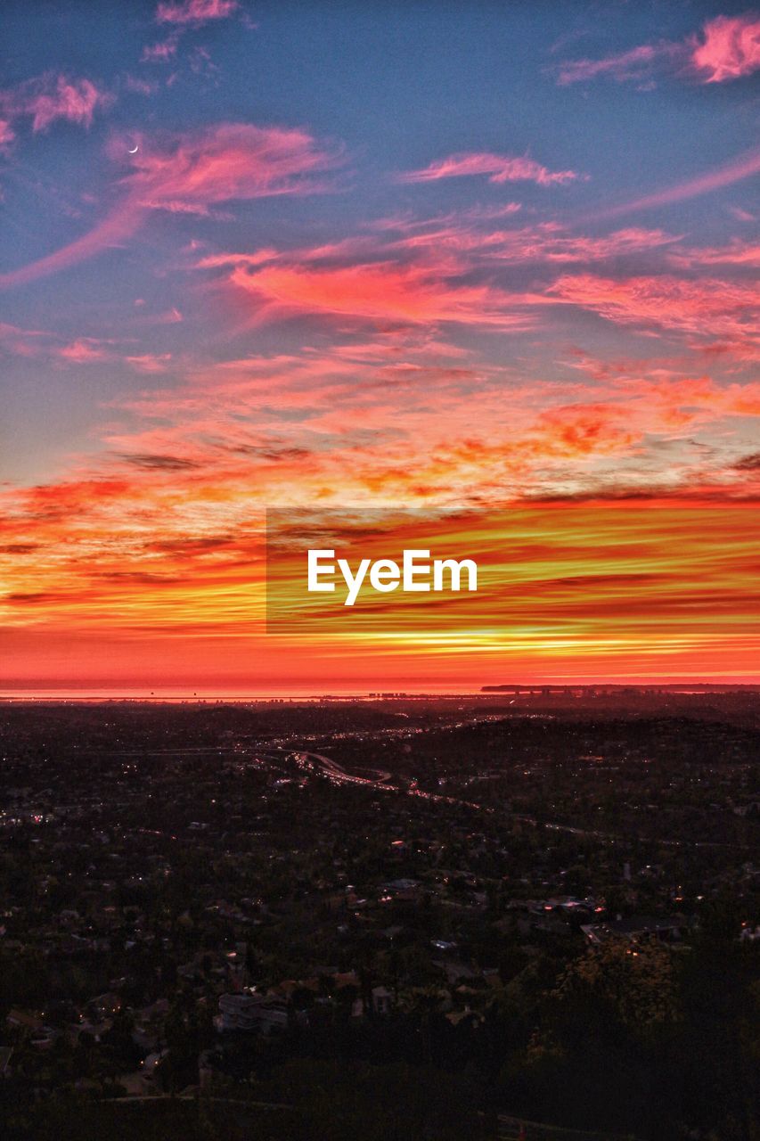 SCENIC VIEW OF DRAMATIC SKY DURING SUNSET