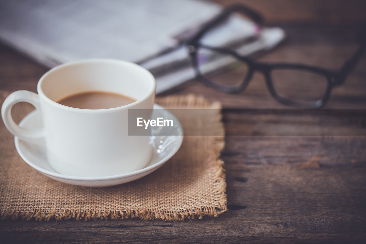 Close-up of coffee cup on table