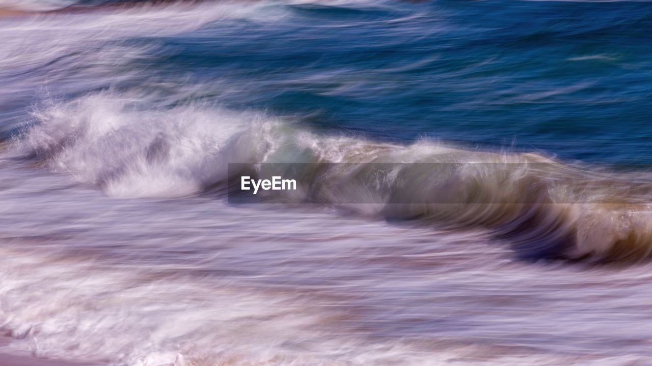 CLOSE-UP OF WAVE ON SEA