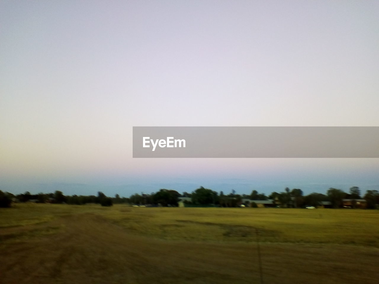 SCENIC VIEW OF FARM AGAINST CLEAR SKY