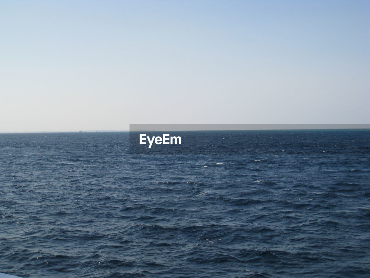 SCENIC VIEW OF SEASCAPE AGAINST CLEAR SKY