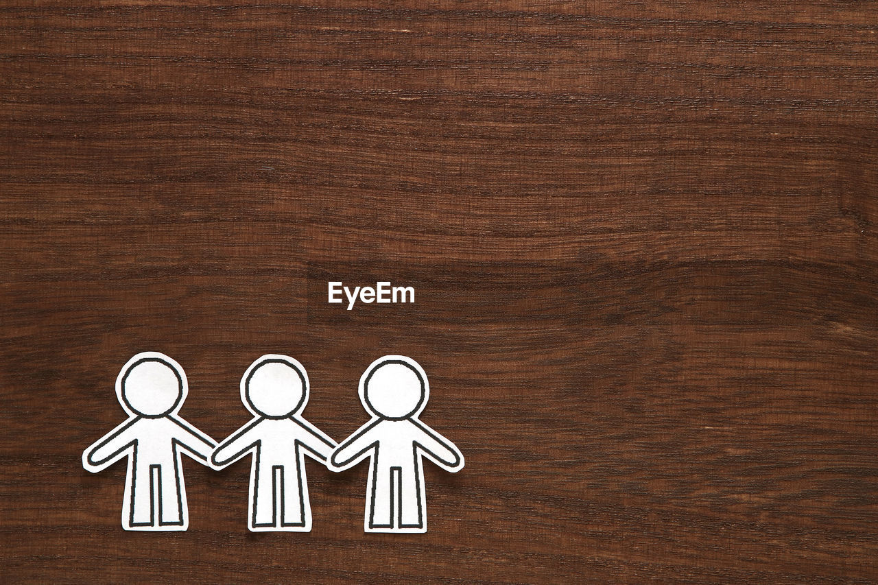 Human representation on wooden table