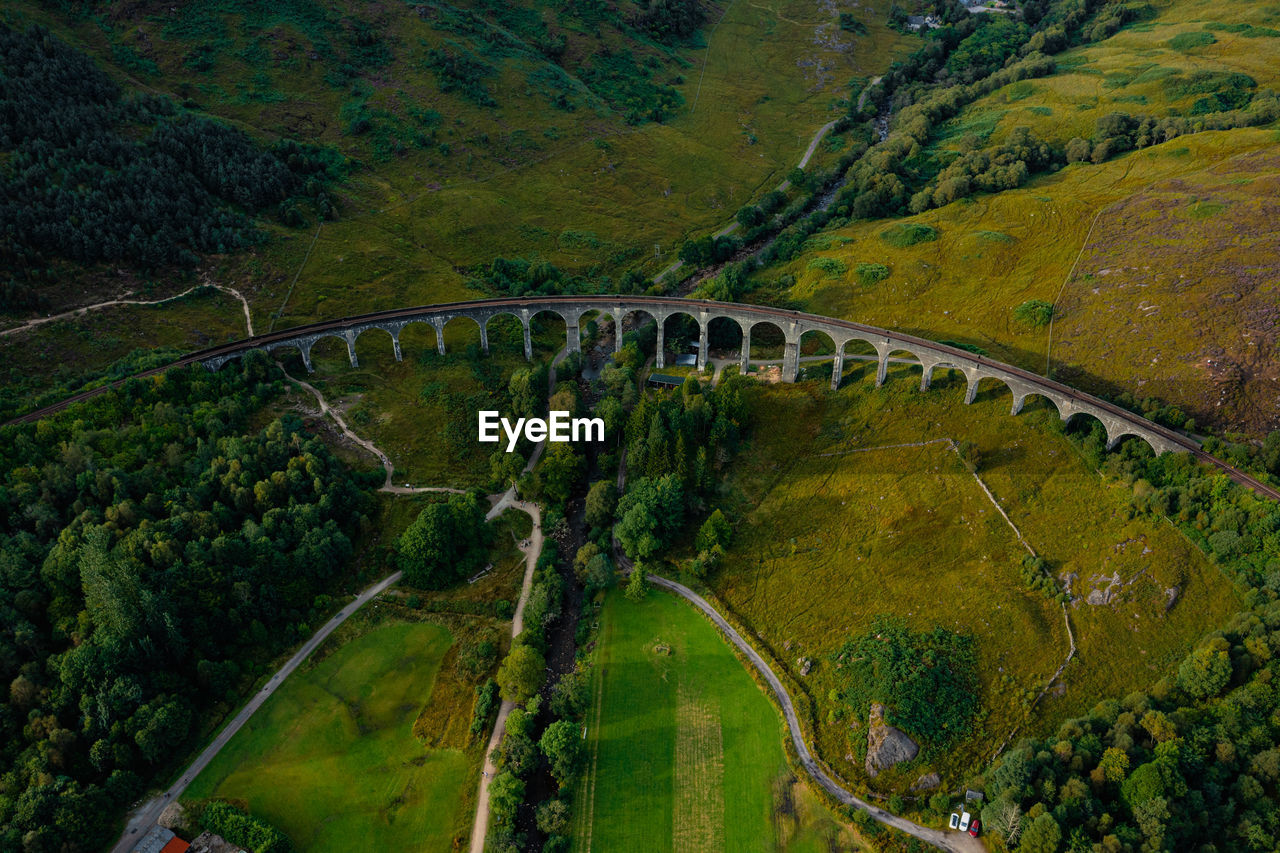 Glenfinnan historic rail viaduct in scottish highlands. full frame wide angle view in clouds day