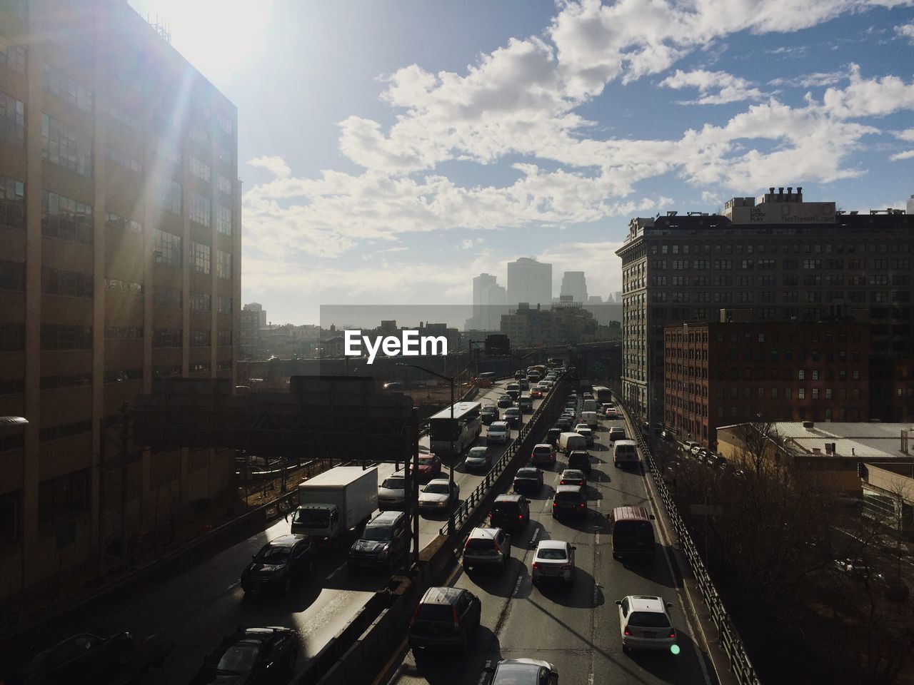 High angle view of vehicles on road along buildings