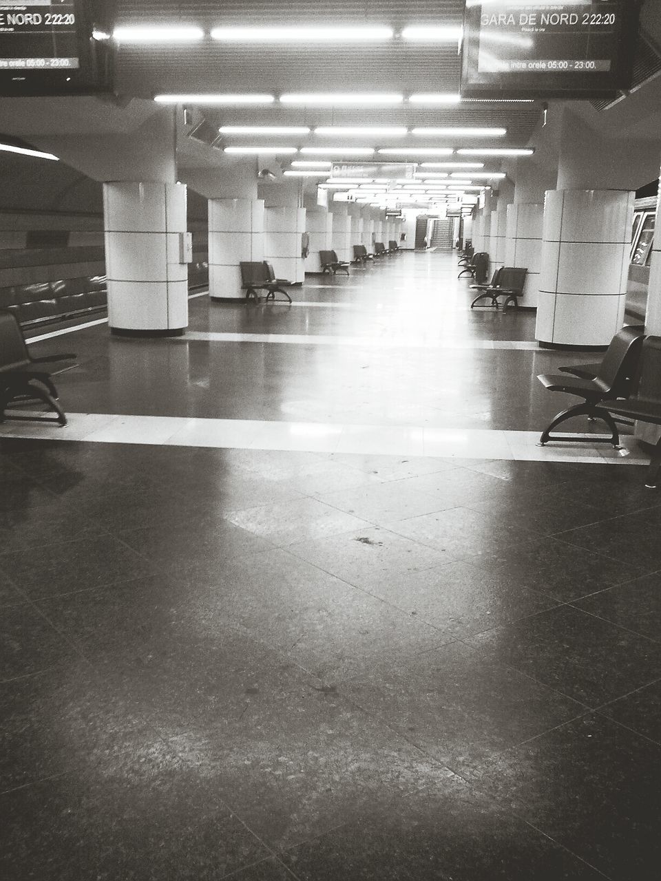 Empty chair in illuminated subway station