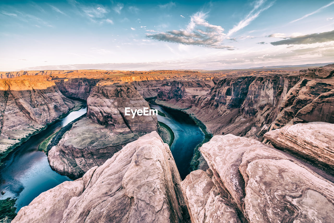 SCENIC VIEW OF ROCKS AGAINST SKY