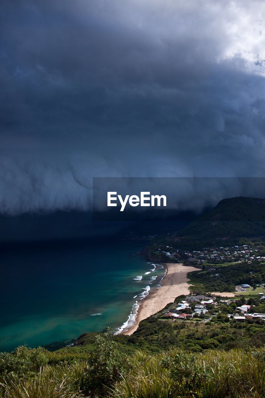 Scenic view of sea against storm clouds